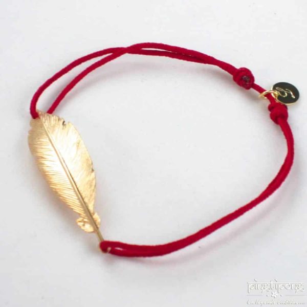 Bracelet L'AVARE bijoux en forme de plume en vermeil et fil de coton rouge